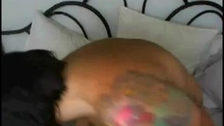 Tattoo chick rides fake dick toy hard in her bedroom